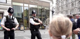 Security guard Abdullah restrains a knifeman who attacked a young girl and her mother in Leicester Square.