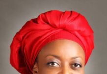 Attorney General Lateef Fagbemi and US Ambassador Richard Mills Jr. signing the asset return agreement in Abuja.