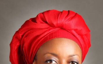 Attorney General Lateef Fagbemi and US Ambassador Richard Mills Jr. signing the asset return agreement in Abuja.