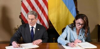 US Treasury Secretary Scott Bessent and Ukrainian Economy Minister Yulia Svyrydenko sign a deal that gives the United States preferential access to Ukraine's mineral resources.