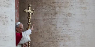 The newly elected Pope Leo XIV appears before the crowds in St. Peter's Square, saying they must "seek together to be a missionary church. A church that builds bridges and dialogue."