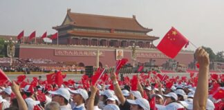 People gather at Tiananmen Square in Beijing on September 3, 2025, for a military parade marking the 80th anniversary of Japan's defeat in World War II